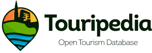 Logo voor Touripedia, met een locatiepin met gestileerd landschap en gebouwen, naast de tekst Touripedia en de tagline Open Tourism Database.