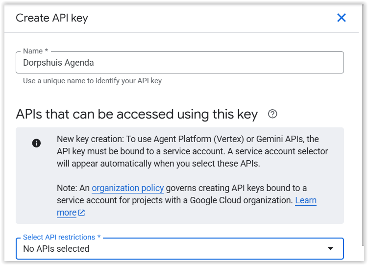 Het paneel Create API key, met een veld Name en onderaan Select API restrictions op No APIs selected.